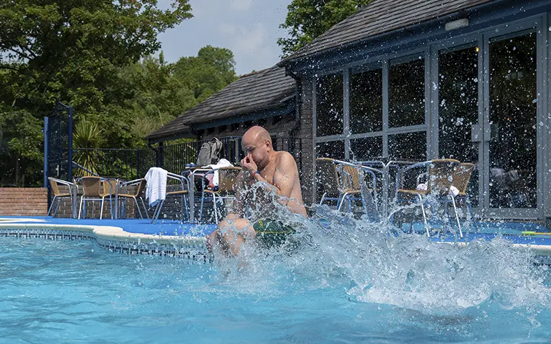 Man Jumping into Pool