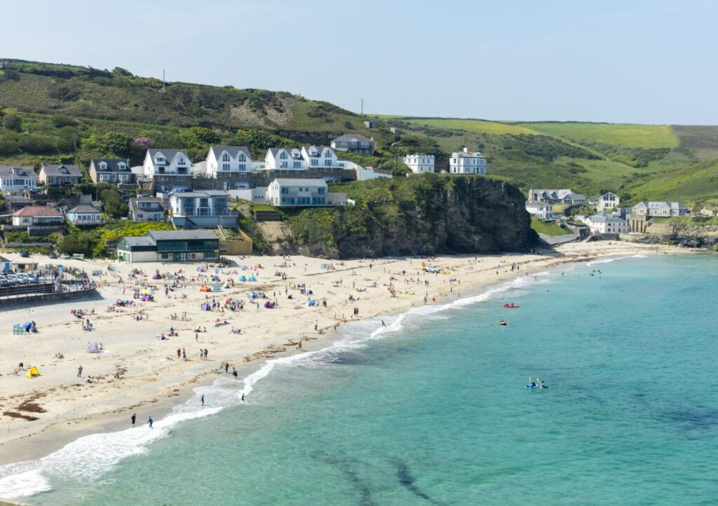 Visitors on the white sands at Portreath Beach