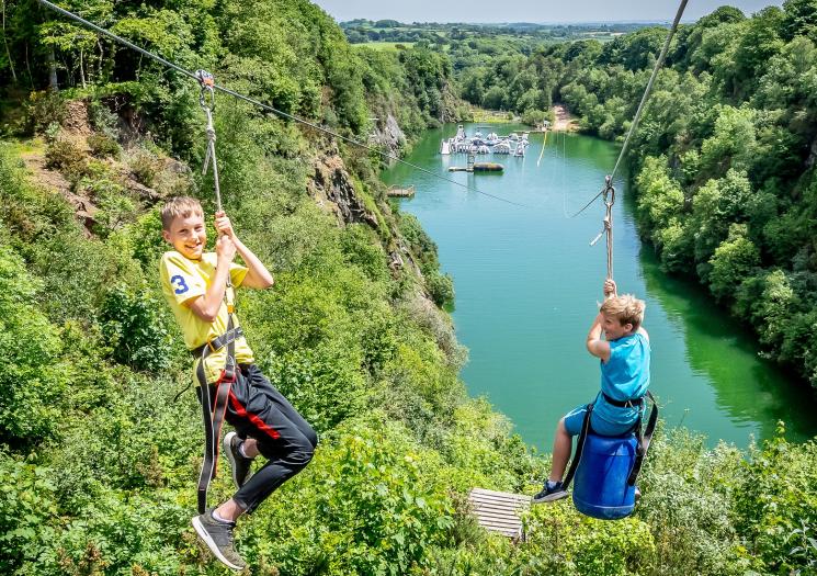 Two boys on the zip wire at Adrenalin Quarry