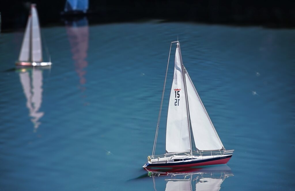 Model boats sailing on water