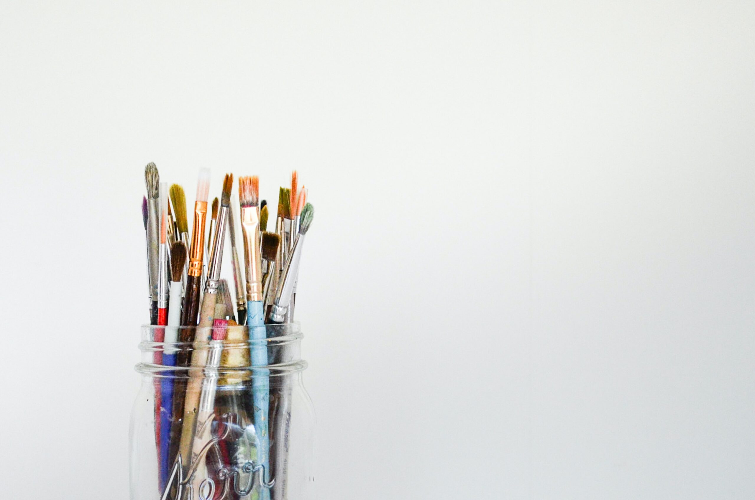 Paint brushes in a glass pot