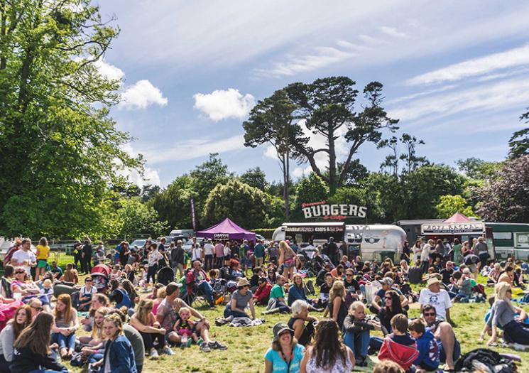 People at a festival near food vans