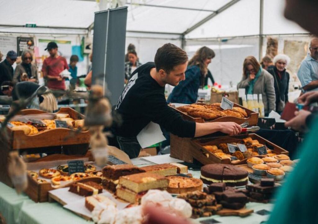 A man working at a food stall at Truro food festival