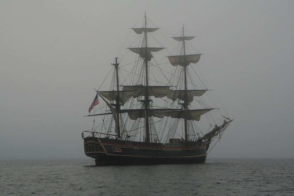 An old boat in the misty sea