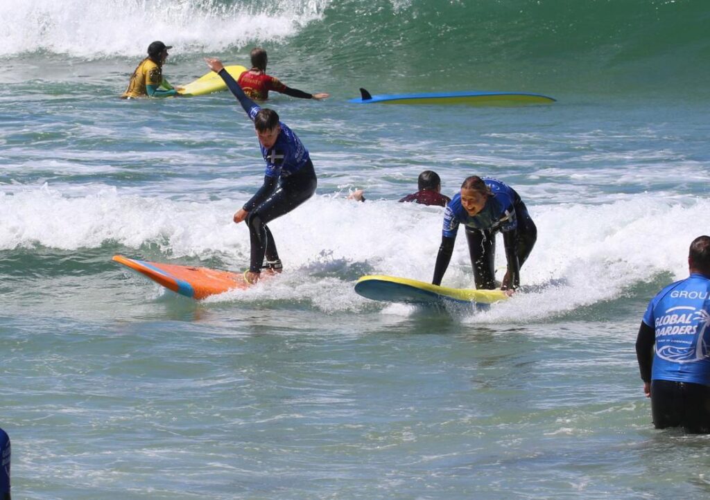 A group of surfers in the sea